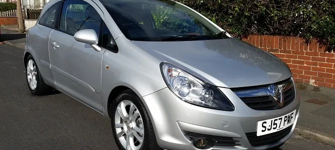 An immobilised Vauxhall Corsa D parked on the road.
